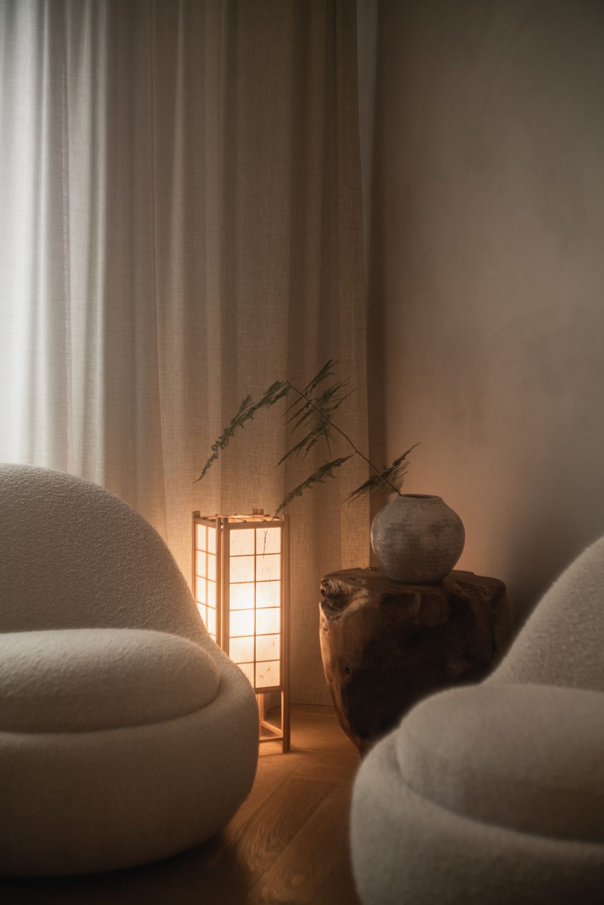 A calm interior corner with arched windows